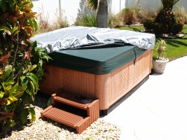 3 corners of the spa cap are now on the hot tub cover and lifter